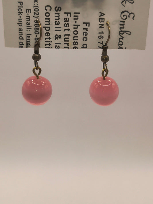Blush-coloured glass earrings