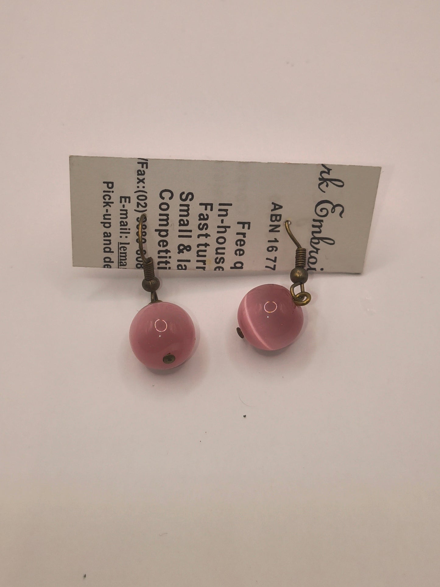 Blush-coloured glass earrings